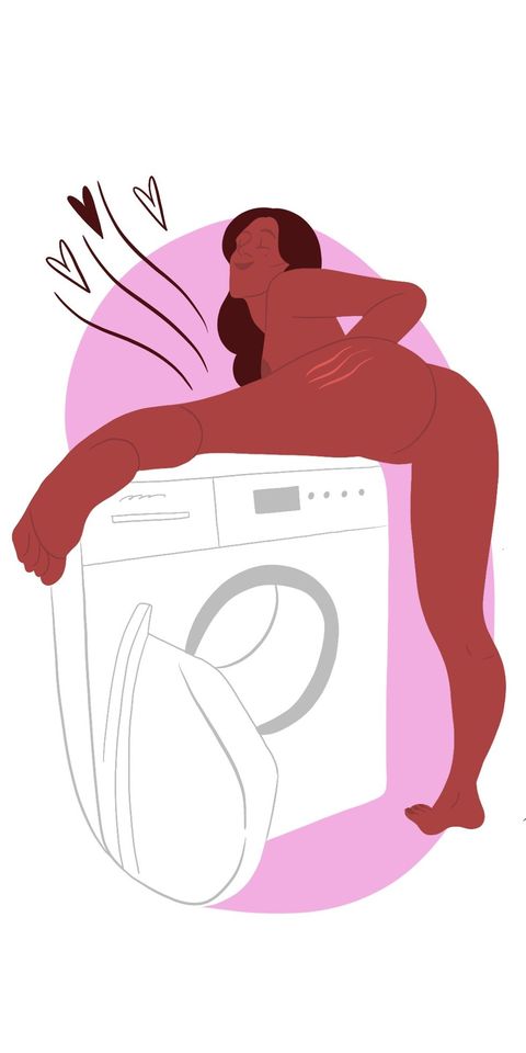 woman pressing her vulva against a vibrating washing machine