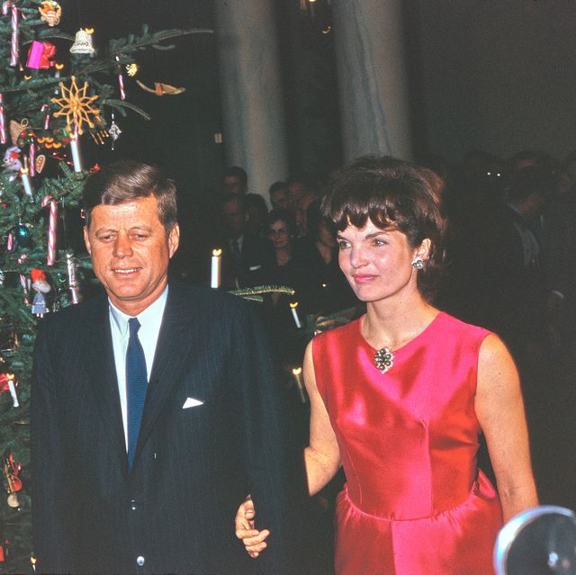 this photograph by george f mobley shows president john f kennedy and first lady jacqueline kennedy attending the white house staff christmas reception the reception took place on december 12, 1962 in the entrance hall of the white house this would be their last christmas celebration in the white house