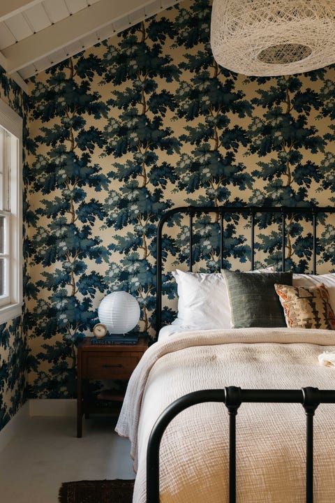 bedroom, tree wallpaper, earth tones bed linen