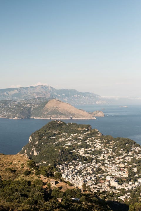 Sky, Mountainous landforms, Mountain, Sea, Coast, Hill, Promontory, Highland, Lake, Horizon, 