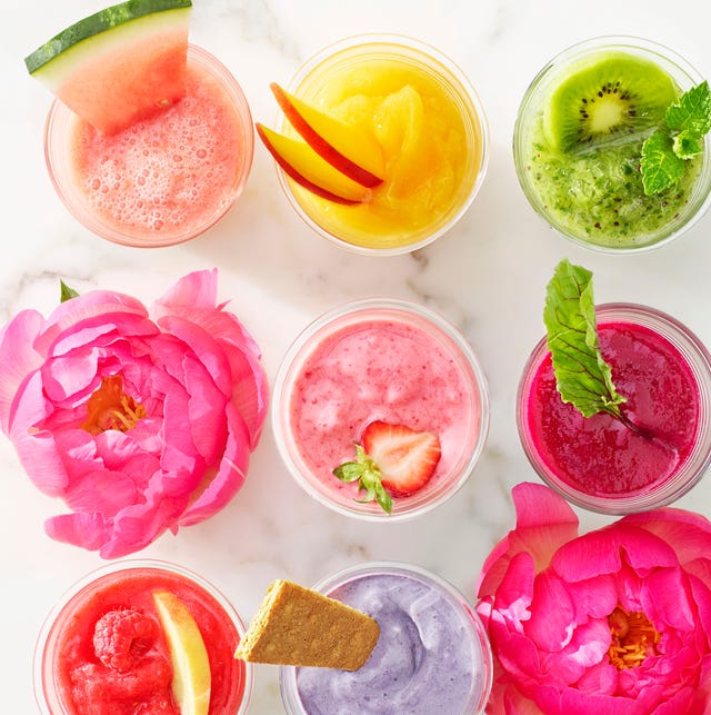 summer drinks  colorful fruity drinks lined up on marble countertop