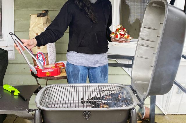 woman grilling on the pk300 grill