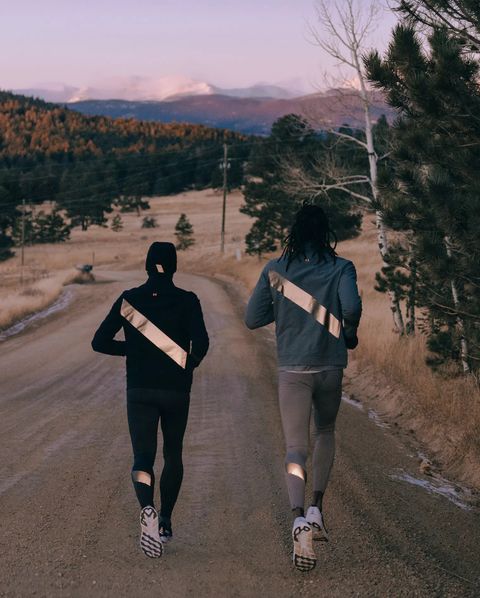 two people running along road wearing tracksmith's no day off collection
