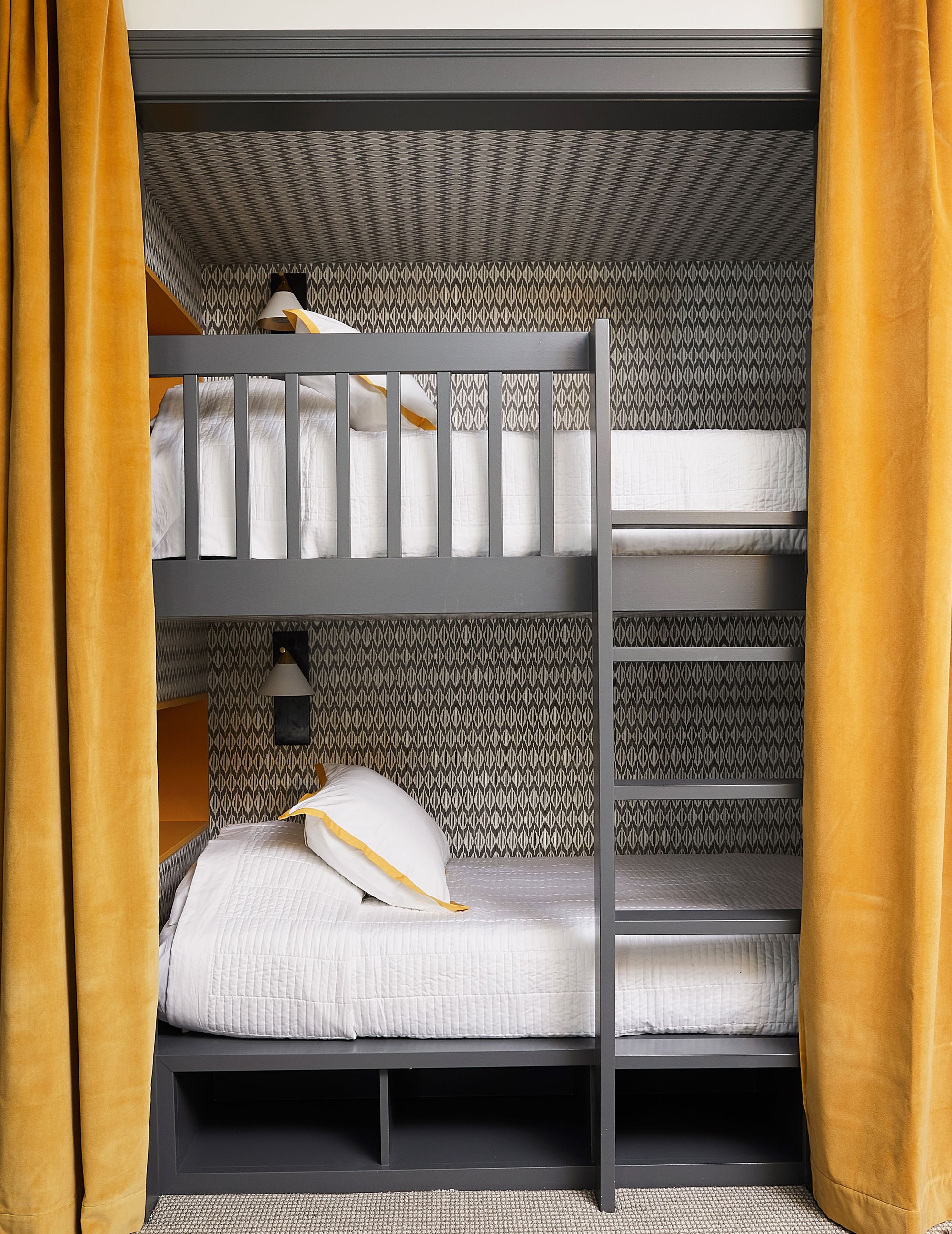 bunk beds with a double bed at the bottom