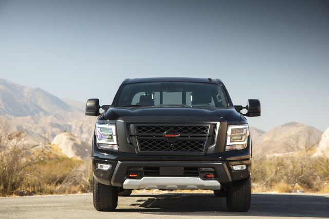 nissan titan viewed from the front with desert mountains in the background