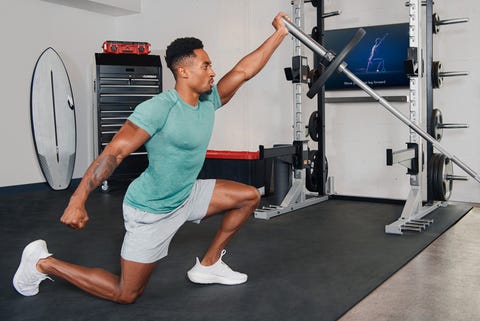 man working out in his garage gym