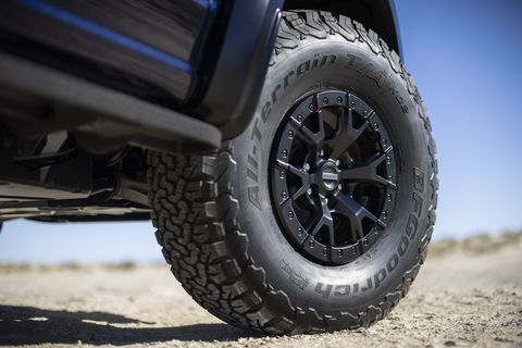 ford raptor r front right tire in the desert