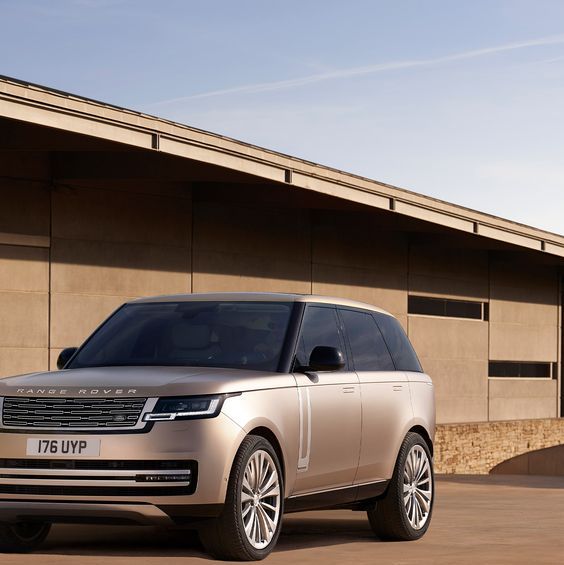 new range rover parked in front of modern house