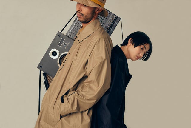 man wearing goldwin mackintosh raincoat