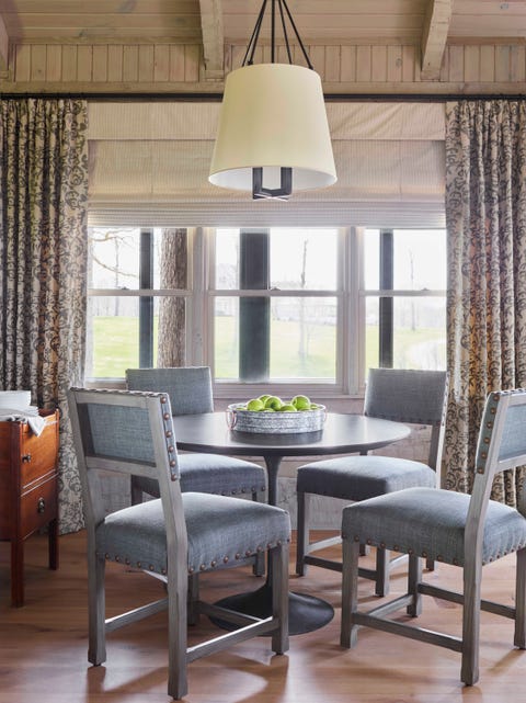 dining table, gray dining chairs, circular wooden dining table, floral curtains