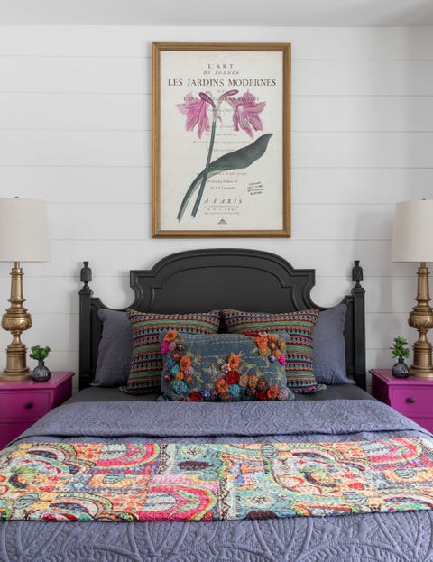 Bedroom, main bed, purple side tables, black headboard