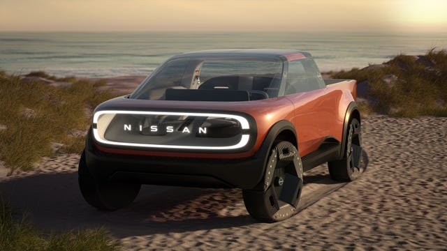 nissan surf out electric pickup truck concept on a beach