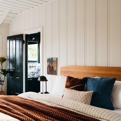 main bedroom, bed with wooden headboard