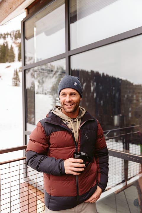 man wearing artilect's high af down stretch parka