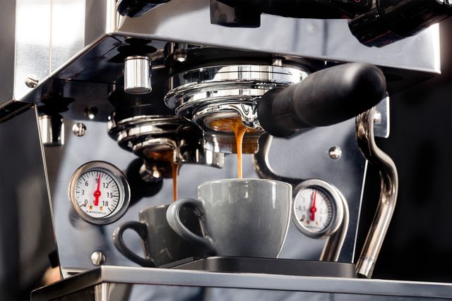 la marzocco linea micra espresso machine putting espresso into a cup