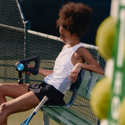 Tennis player using Theragun Pro on upper leg tennis player using theragun pro on upper leg