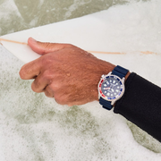 closeup of Citizen dive watch on surfer's wrist closeup of citizen dive watch on surfer's wrist