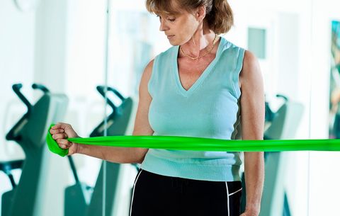 woman exercising her rotator cuff
