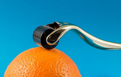 skin needling roller on an orange