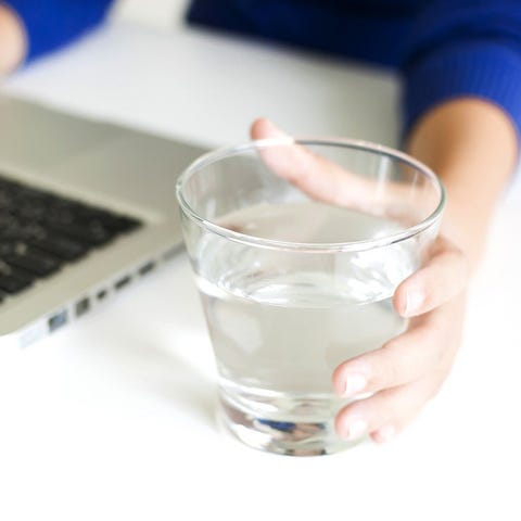 Glass of water on desk Glass of water on desk