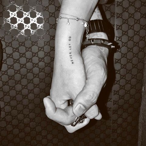 White, Hand, Wrist, Finger, Holding hands, Arm, Temporary tattoo, Mehndi, Design, Gesture, 