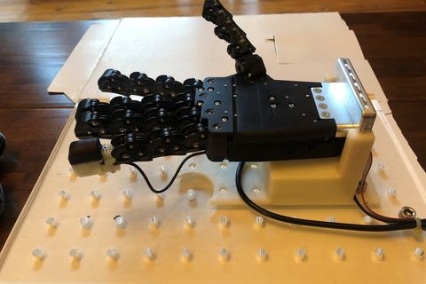 robotic hand with a 3d printed tactile fingertip on the pinky finger