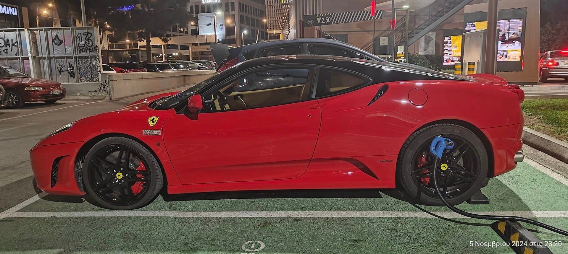 Ferrari F430 Driver Blocks EV Charging Station, Plugs Charger Into Rear Wheel