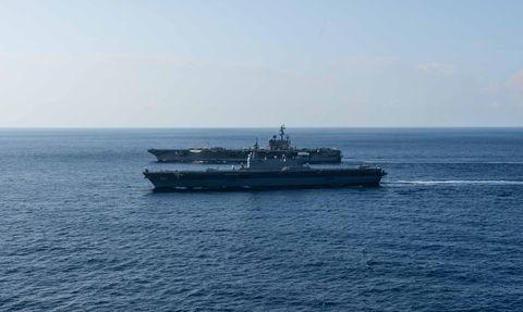 190619 n pj626 0004 south china sea june 19, 2019 the us navy’s forward deployed aircraft carrier uss ronald reagan cvn 76 sails alongside the japan maritime self defense force helicopter destroyer js izumo ddh 183 while conducting operations in the south china sea ronald reagan, the flagship of carrier strike group 5, provides a combat ready force that protects and defends the collective maritime interests of its allies and partners in the indo pacific region us navy photo by mass communication specialist 2nd class kaila peters