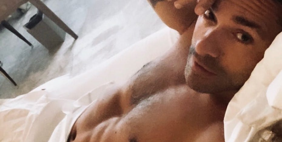 Kelly Ripa Just Shared a Shirtless Photo of Mark Consuelos in Bed
