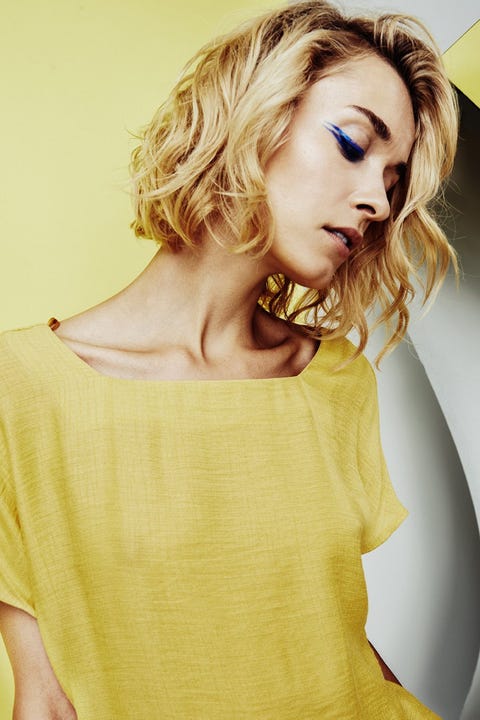 Lip, Yellow, Hairstyle, Sleeve, Shoulder, Joint, Eyelash, Style, Fashion model, Jewellery, 