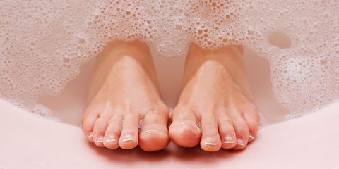 Feet sticking out of bathtub