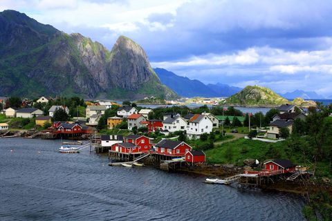 red rorbu cabins on the fjord in reine in the lofoten islands, norway