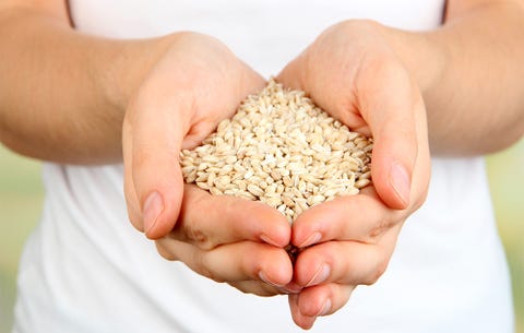 woman holding seeds