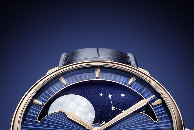 watch dial with a large moon phase