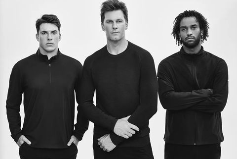 Tom Brady modeling his clothes with two others