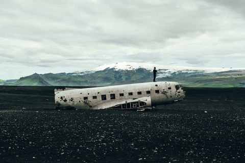 Abandoned Airplane On Landscape Against Sky