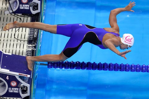 abby weitzel diving off the block to compete in a race