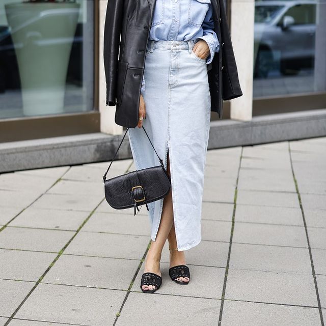 frankfurt am main, germany   july 06 influencer sarah lou falk wearing a black leather blazer by tory burch, a light blue denim jeans blouse by edited, a light blue denim jeans maxi skirt with front slit by edited double denim look a black bag by bash, black mesh sandals by dior and sunglasses by barton perreira seen at frankfurt fashion week on july 6, 2021 in frankfurt am main, germany photo by streetstyleshootersgetty images