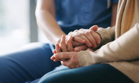 You're in a safe space now cropped shot of a senior woman holding hands with a nurse