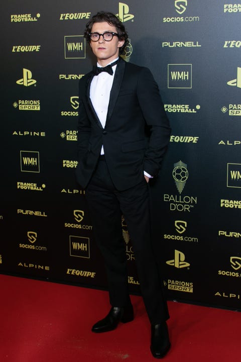 Tom Holland posing separately at the Ballon D tom holland posing separately at the ballon d