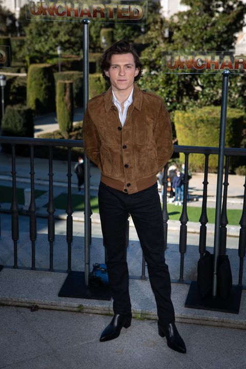 tom holland attends "uncharted" madrid photocall