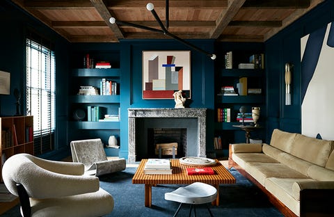 Living rom with contemporary furniture, teal walls and timber ceiling