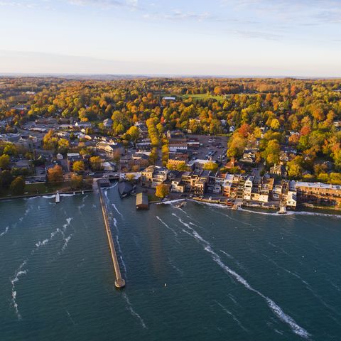 Aerial of Small Village on Lakeshore in Autumn
