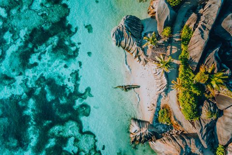 aerial photo of famous paradise like tropical beach anse source d argent at la digue island, seychelles summer vacation, travel and lifestyle concept
