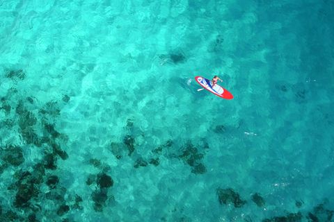 Aerial view of woman on paddleboard