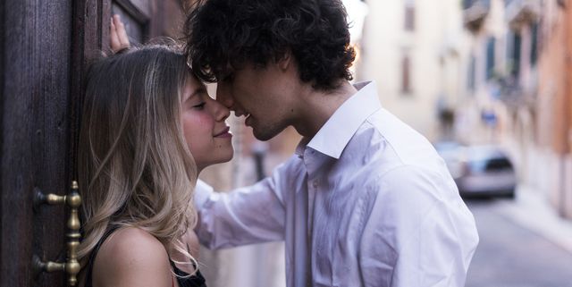 affectionate young couple in love kissing in the city