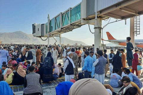 prominent afghans crowd the tarmac at kabul airport on august 16, 2021, to flee the country as the taliban controlled afghanistan after president ashraf ghani fled the country and admitted that insurgents had won the 20 years war photo by afp photo by afp via getty images