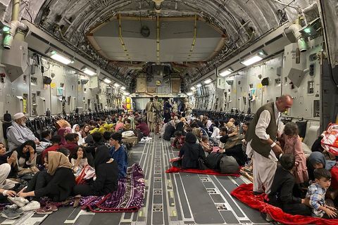 topshot of afghans sit inside australian military plane to leave afghanistan at kabul military airport on august 19, 2021 after taliban military takeover of afghanistan photo by shakib rahmani afp photo by shakib rahmaniafp via getty images