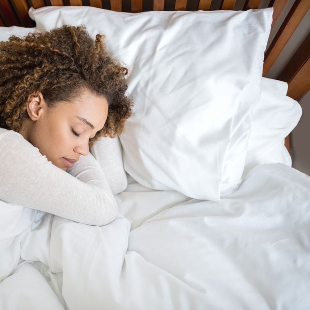 african american woman sleeping in bed