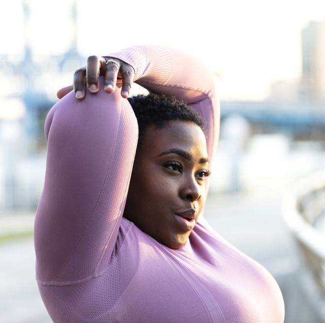 african american woman with large build, stretching